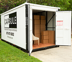 an open CAPSULE container on a driveway